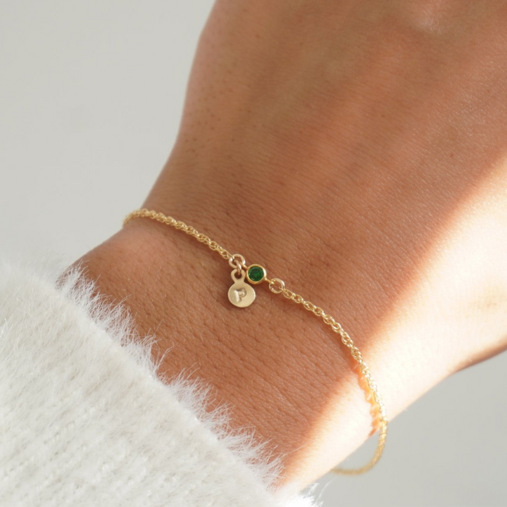 Detail of the hand-stamped initials on the bracelet