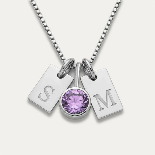 Close-up of the birthstone and engraved initials