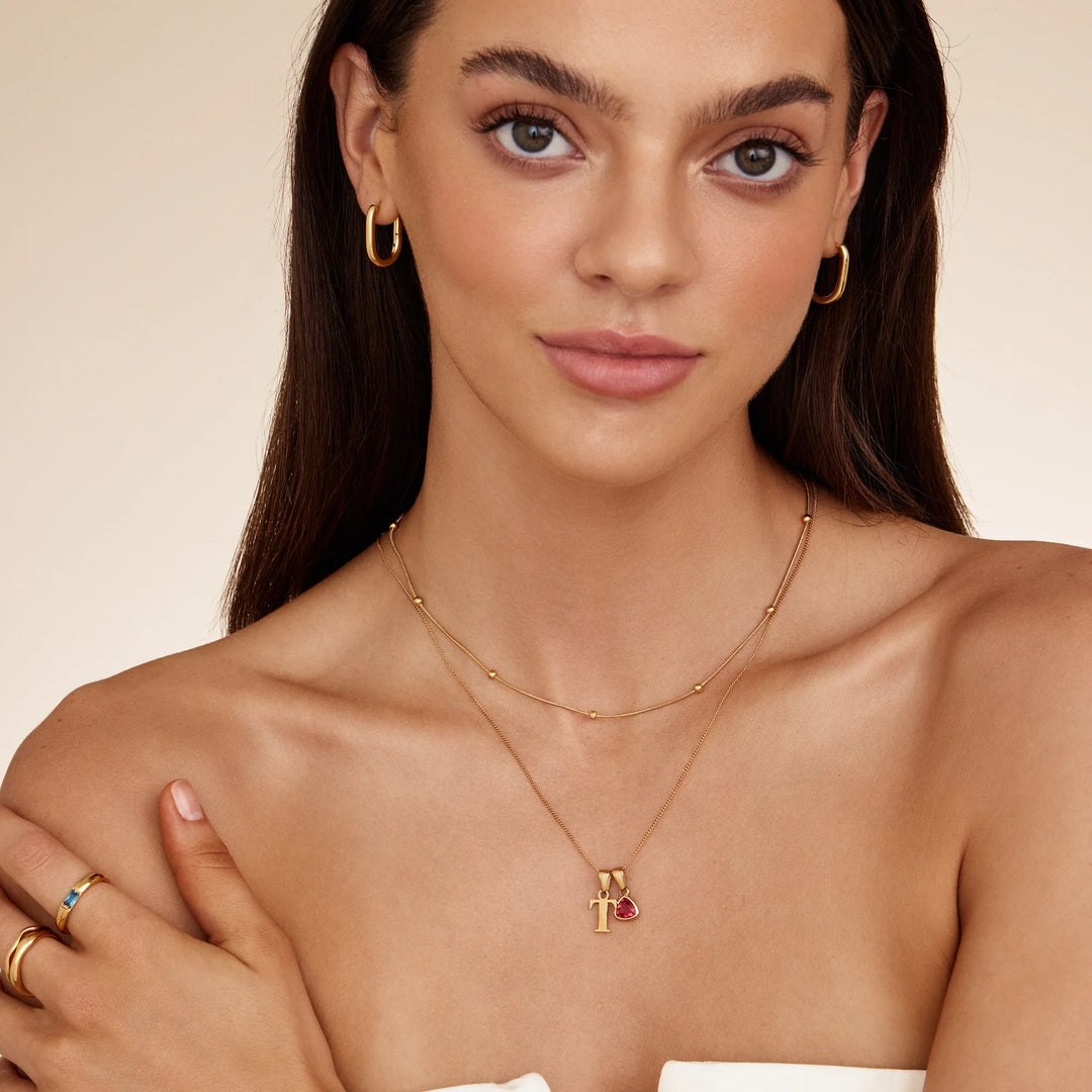 Collar inicial T con piedra de aniversario de julio