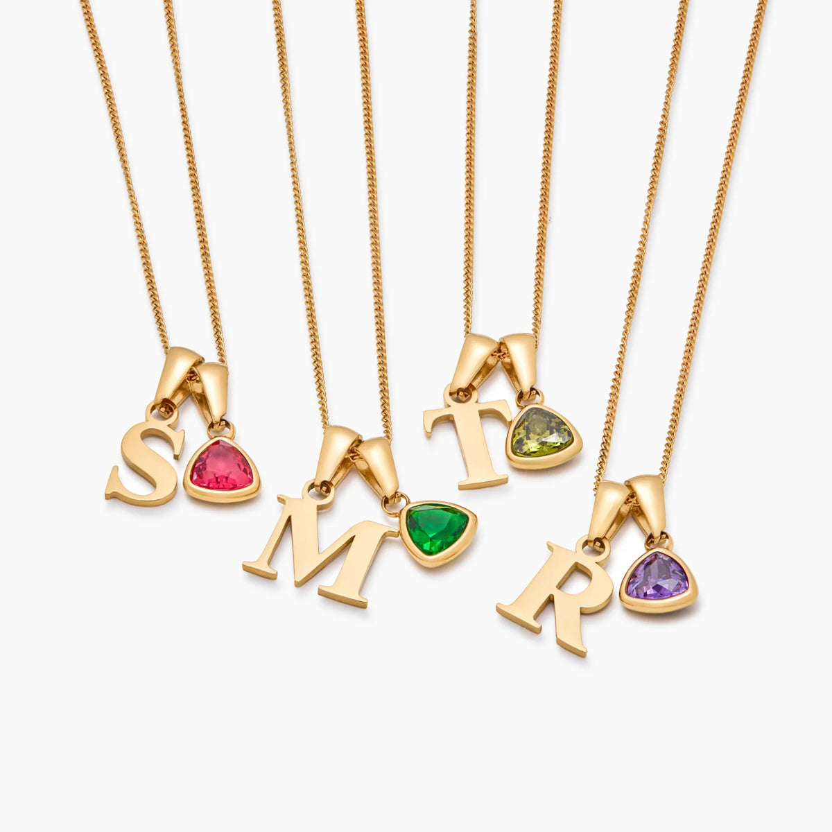 Collar inicial con piedra de aniversario: letras S, M, T y R con distintas piedras
